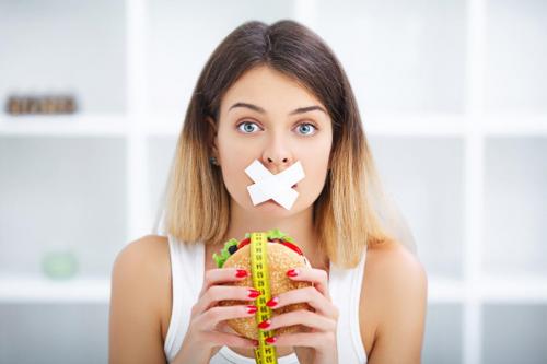 Girl taped mouth cheeseburger