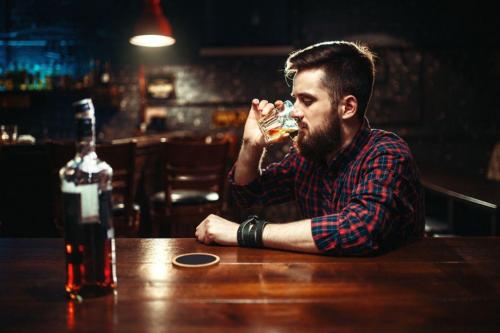 Man drinks alone